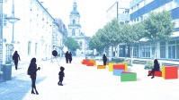 Blick auf eine Visualisierung der Aktionsfläche, auf der viele bunte Dreiecke als Sitzgelegenheiten dienen